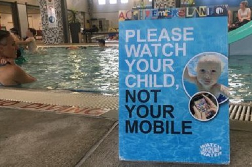 Life Saving Victoria’s Watch Around Water urges parents to put their down phones when at the pool