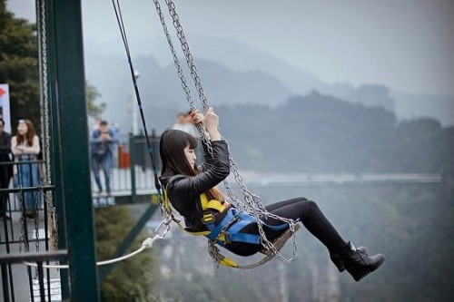 Chinese attraction opens giant swing above 300 metre chasm