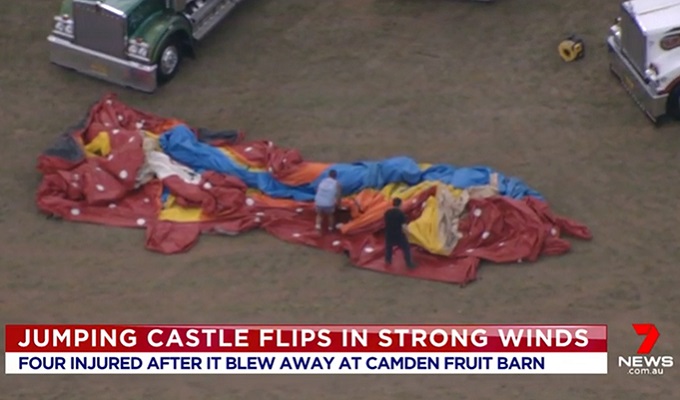 Children fall 8 metres to the ground after winds lift inflatable slide into the air in Western Sydney