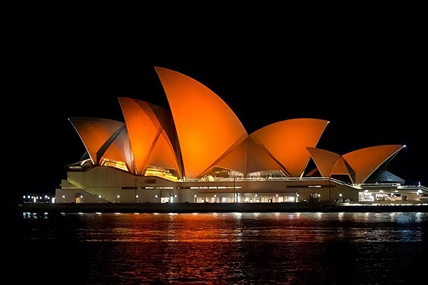 Sails of Sydney Opera House glow orange in recognition of NSW SES volunteers  